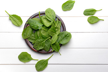 Image of Plate with fresh spinach on white table printed on Printed Glass Basin Splashbacks