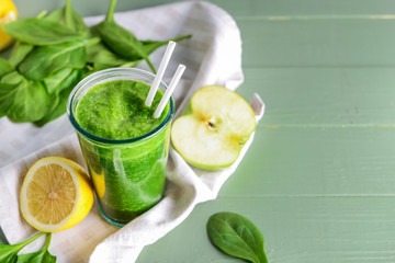 Glass of fresh smoothie on wooden table