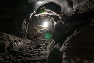 Dark Tunnel Cave has no body. Tourist route, tours, adventures and interesting places. inside...