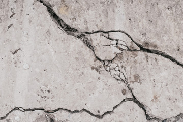 Crack concrete wall. Old dirty cracked wall texture. Gray stone background. Abstract pattern of...