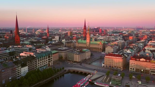 aerial view drone of hamburg city center from alster at sunrise flying over lake