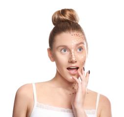 Young woman with contouring makeup on white background