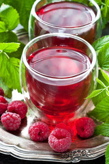 Raspberry beverage with berries, selective focus