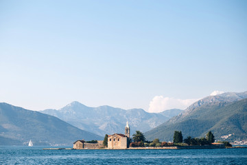 Adriatic Sea, Montenegro. View of a small church on the island of St. George in the Bay of Kotor,...