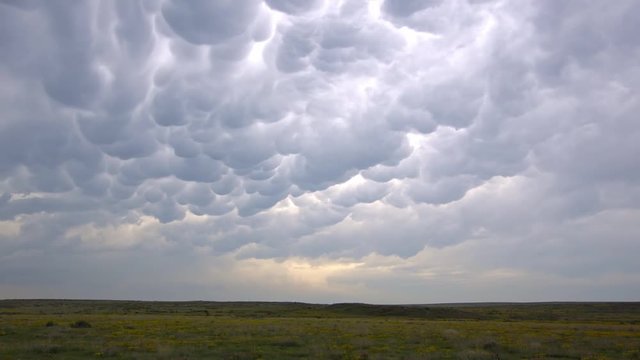 Time lapse of mammatus clouds rolling through the sky after a storm in Oklahoma.