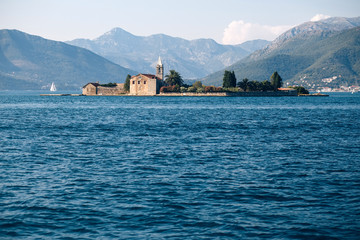 Adriatic Sea, Montenegro. View of a small church on the island of St. George in the Bay of Kotor,...