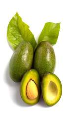 fresh avocado with leaves on white background