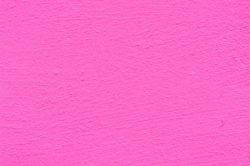 Background of a pink stucco coated and painted exterior, rough