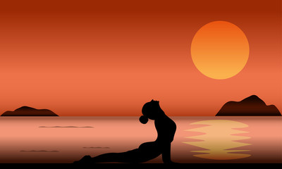 Naklejka na ściany i meble ilhouette of woman yoga activity at the beach in sunset time