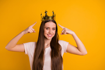 Close up photo beautiful amazing she her lady leader chief gold crown head fingers indicate special status pop star girls run world concept wear casual pastel t-shirt isolated yellow bright background © deagreez