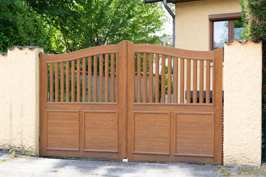 Brown wooden gates of private house