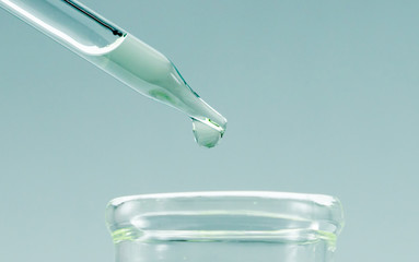 Pipettes take samples to a test tube containing chemicals.
