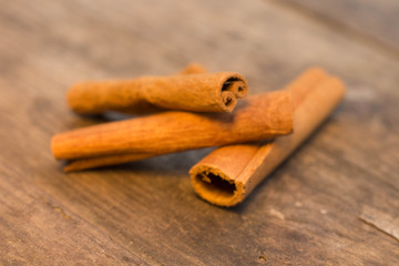 cinnamon sticks on the wooden table and cinnamon powder
