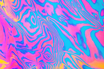 Abstract trendy neon colored psychedelic fluorescent striped zebra textured background.