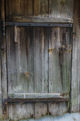 Old wooden door of the boards in the bath.