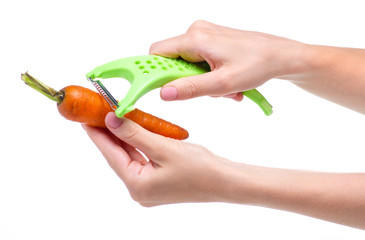 Carrot vegetable peeler in hand on white background isolation