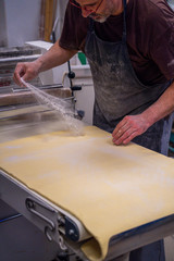 confectioner works the puff pastry dough, artisan, gourmet