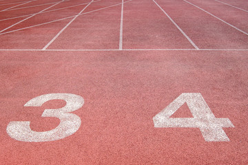 Running track at the stadium with different numbers and white lines