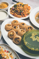 group of Bombay chat food includes golgappa/panipuri, bhel-puri, sev-poori, dahipuri, Ragda pattice, raj kachori etc. selective focus