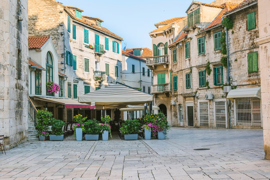 Fototapeta City of Split, Croatia, cafes and shops on an early morning on the Fruit Square in the Diocletians Palace section of Old Town
