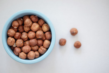 hazelnuts in a blue bowl