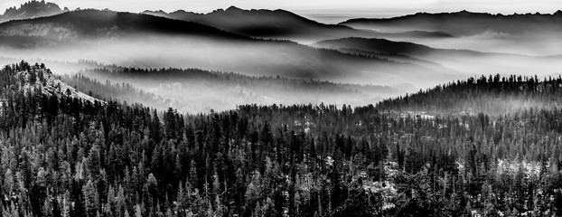 Blank and White Mountains in layers of fog
