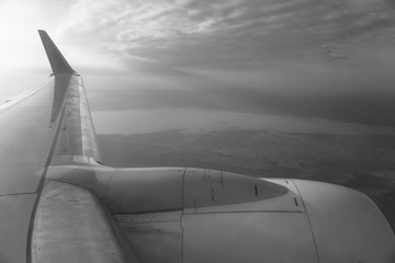 View from the airplane window on the river below. Tourist route to warm countries. The theme of the travel agency. Stock photo