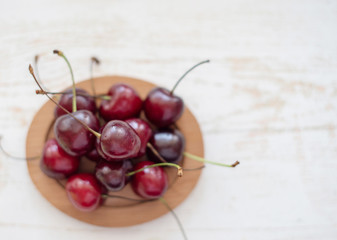 fresh ripe cherries on wooden background