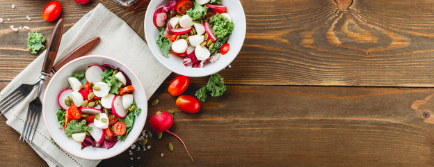 Salad with cherry tomatoes, radsh and mozzarella, lettuce mix