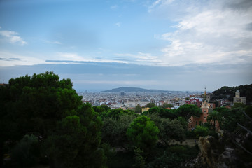 Naklejka na ściany i meble View on Barcelona from Park Guell. Beautiful architecture. Evening sunset panorama.