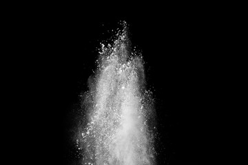 White powder explosion isolated on black background. 