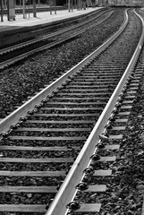 Metro tracks outdoors and black and white