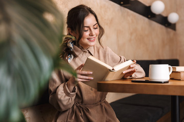 Beautiful lovely woman relaxing at the cafe