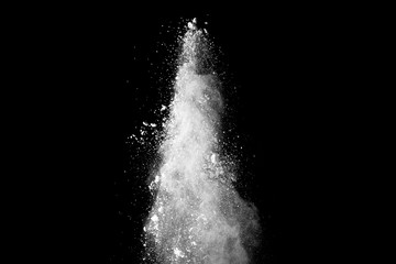 White powder explosion isolated on black background. 