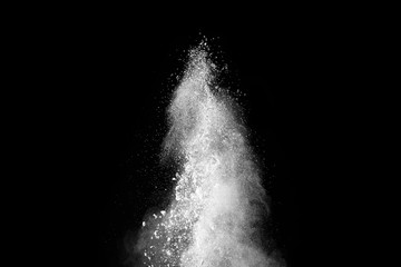 White powder explosion isolated on black background. 