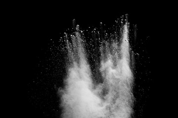 White powder explosion isolated on black background. 
