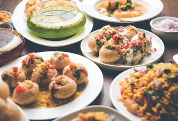 group of Bombay chat food includes golgappa/panipuri, bhel-puri, sev-poori, dahipuri, Ragda pattice, raj kachori etc. selective focus