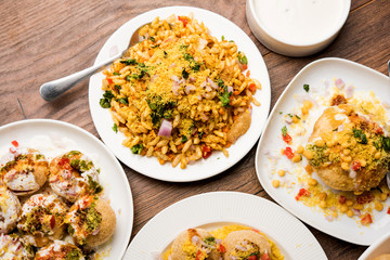 group of Bombay chat food includes golgappa/panipuri, bhel-puri, sev-poori, dahipuri, Ragda pattice, raj kachori etc. selective focus