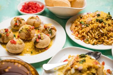 group of Bombay chat food includes golgappa/panipuri, bhel-puri, sev-poori, dahipuri, Ragda pattice, raj kachori etc. selective focus