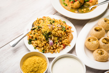 group of Bombay chat food includes golgappa/panipuri, bhel-puri, sev-poori, dahipuri, Ragda pattice, raj kachori etc. selective focus