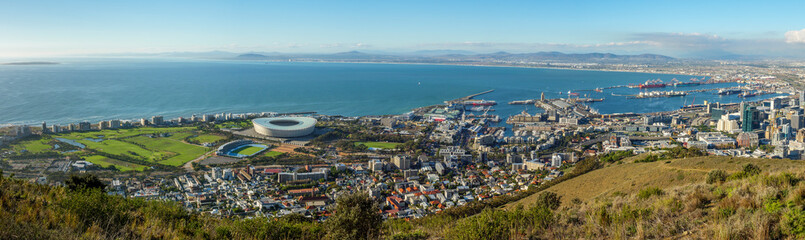 Amazing panoramic view of beautiful Cape Town from Signal Hill showing V&A waterfront, harbour sea point, soccer stadium, Green Point and Robben Island out to sea. Western Cape. South Africa - obrazy, fototapety, plakaty