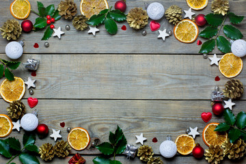 Christmas composition with orange slices, cones, holy, stars, small gift boxes, red and white...