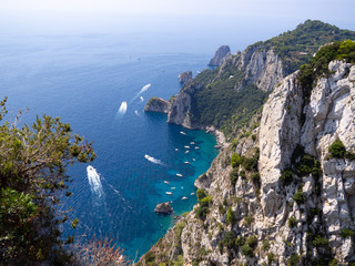 Beautiful view of dramatic cliffs and beautiful blue water in Capri Island in Italy