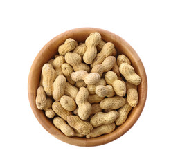 peanuts in wood bowl isolated on white background.top view