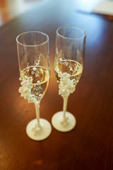 wedding glasses of champagne on the dark background. Soft focus, selective focus