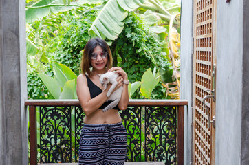 woman is playing with a cat