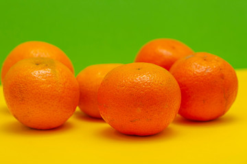 orange fruits on yellow table.fruit summer background 