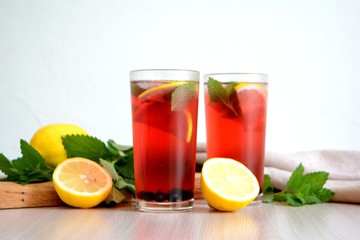 Berry lemonade or sangria in glasses Summer refreshing drink