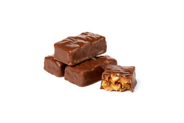 Chocolate sweet with caramel and peanut isolated on white background.