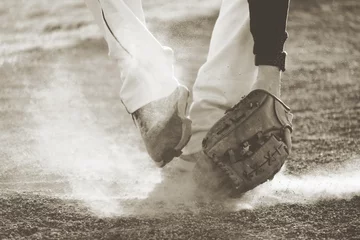 Fotobehang Baseball player fielding grounder ball in field dirt, action shot with vintage sports style. © ccestep8